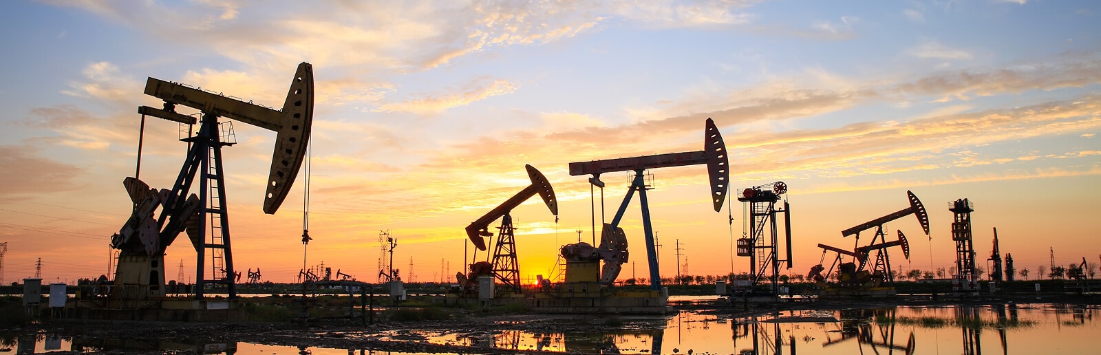 a huge oil field during sunrise