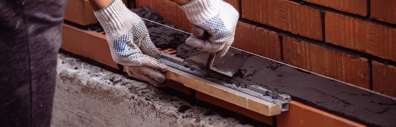 a person laying bricks