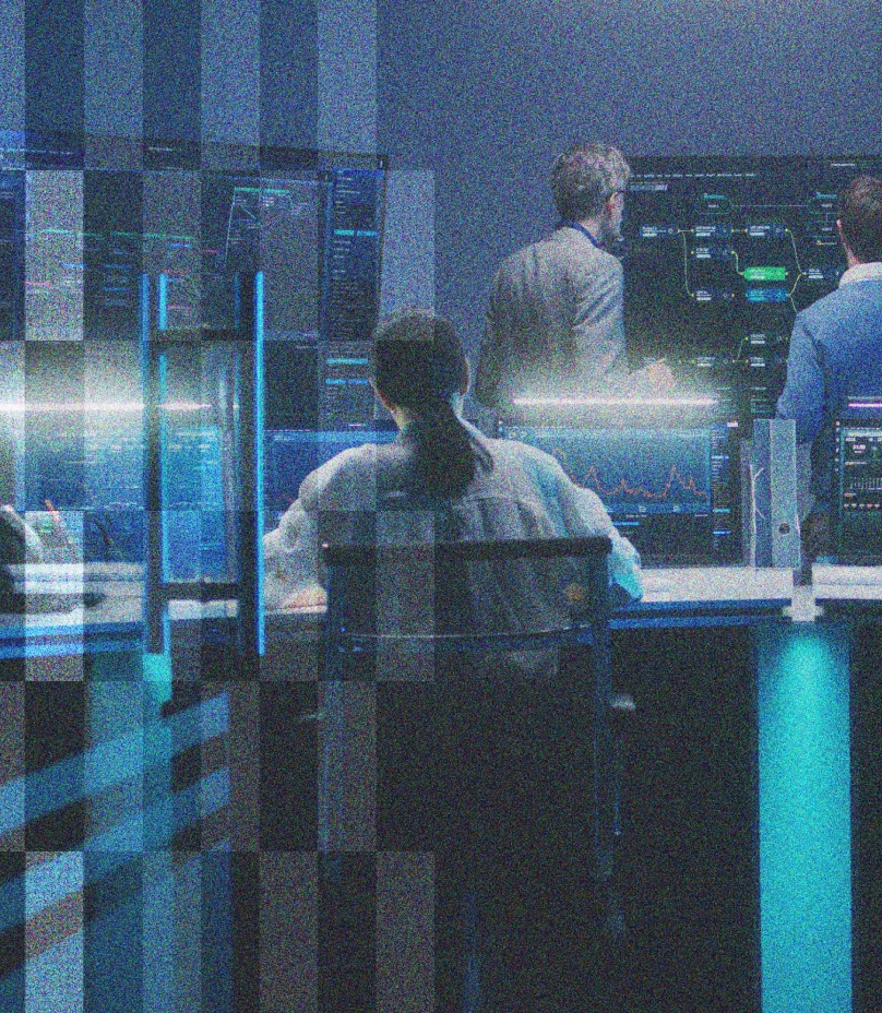 a room of people working on computers