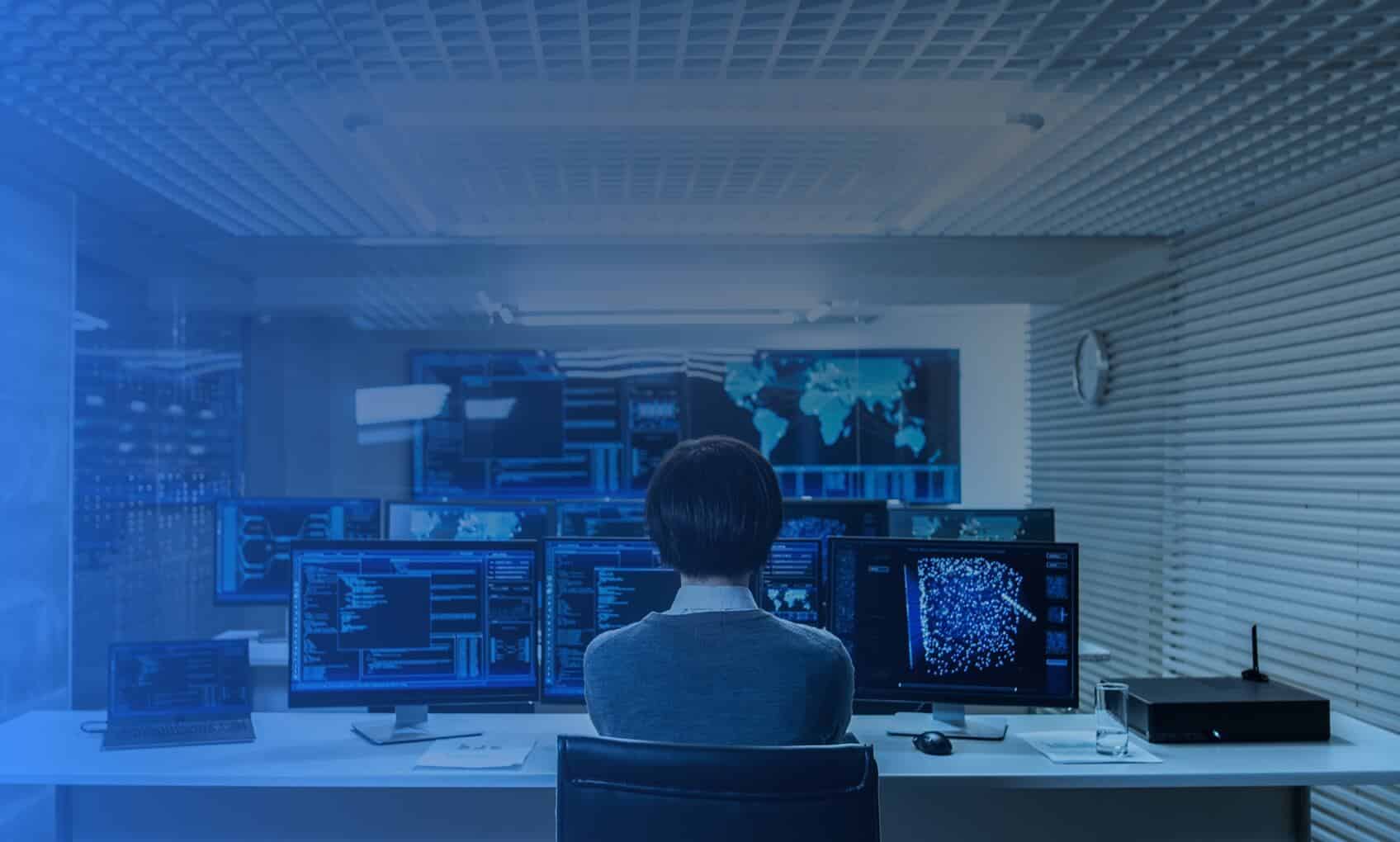 a person working on multiple computers together