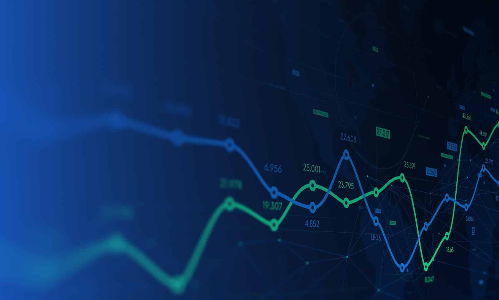 A digital display shows intersecting green and blue line graphs on a dark background, representing fluctuating financial or stock market data—ideal for visualizing trends during an Azure Sentinel Implementation. Data points and numerical values are visible along the lines.