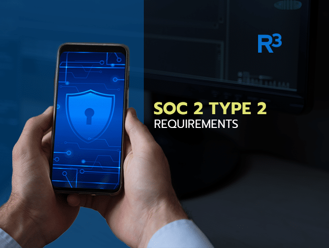 A person holds a smartphone displaying a digital shield with a keyhole icon. Text on the right reads SOC 2 Type 2 Requirements and highlights SOC 2 Trust Principles, with the R3 logo above it and a computer monitor in the background.